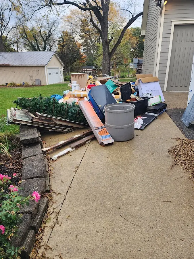 Dumpster being loaded with debris for 30 Yard Dumpster Rental in Milltown